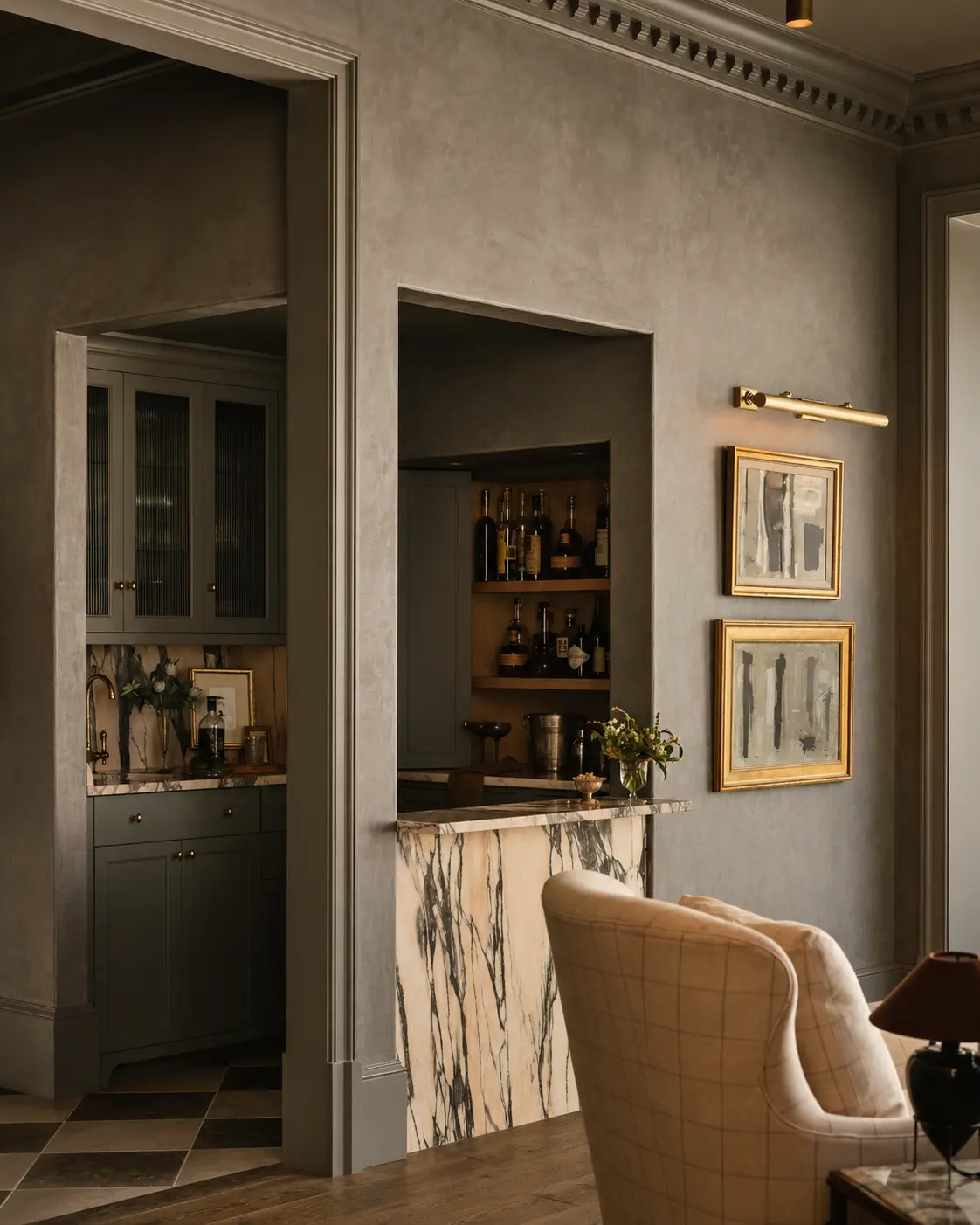 Warm gray matte Roman clay walls in a refined living room with a marble bar and framed art, in a Laguna Niguel project.