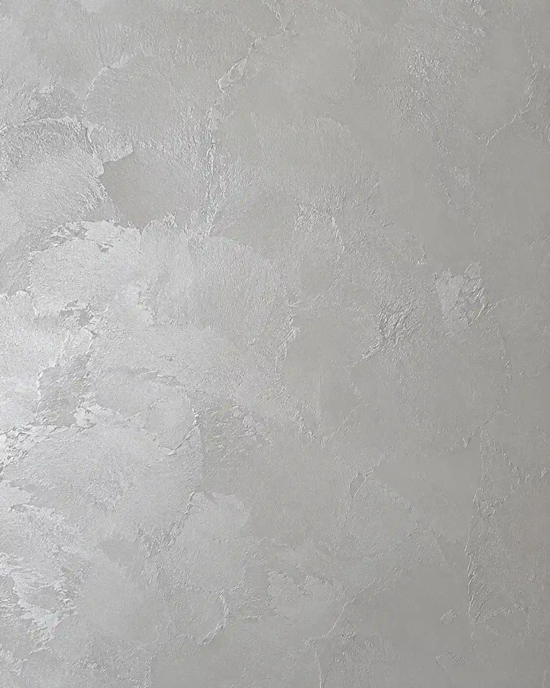 A light-reactive metallic and pearl plaster texture with a soft shimmer.