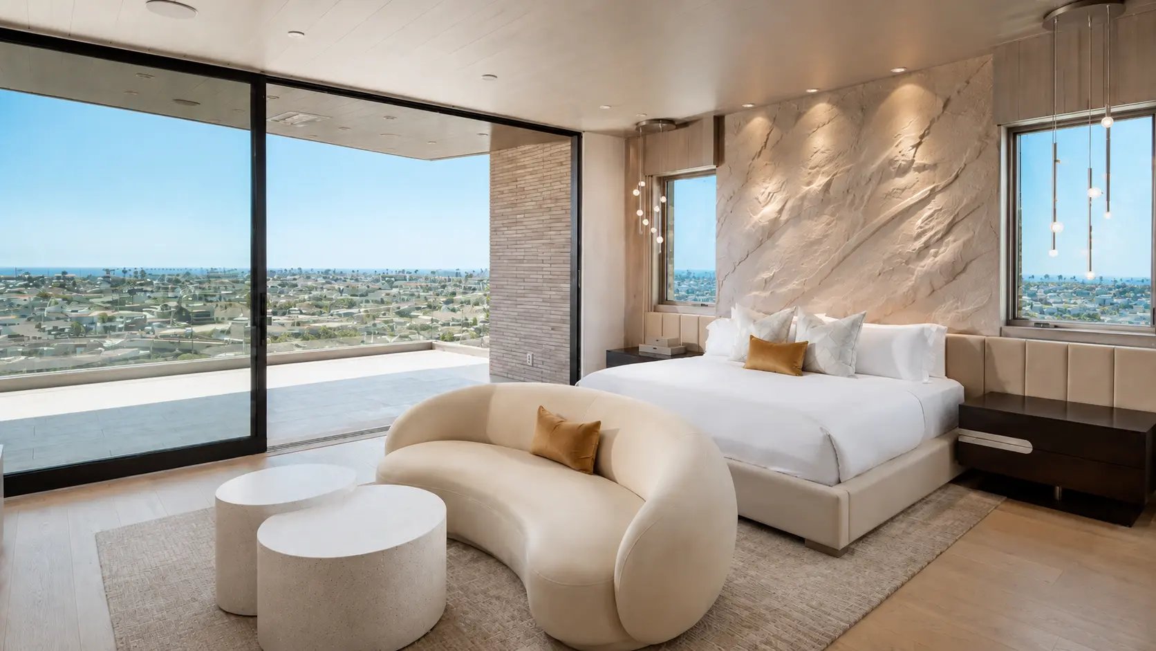 Stone-effect plaster media wall - hand-sculpted, high-relief rock surface around a fireplace