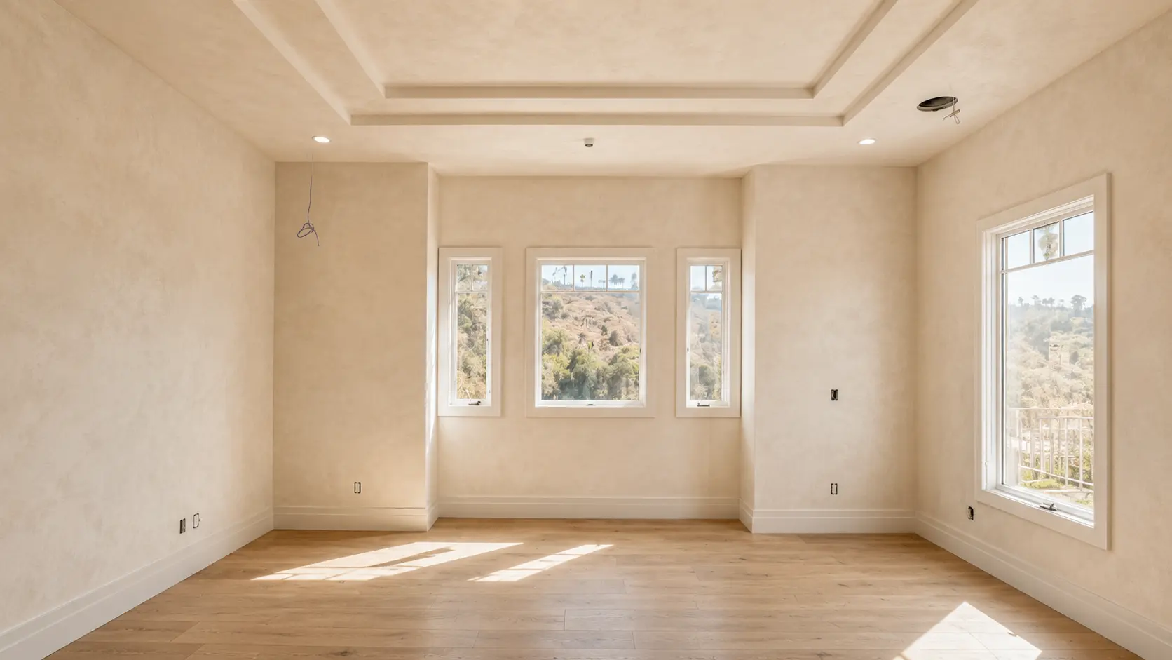 Venetian plaster feature wall in a two-story foyer - polished mineral finish with stone-like depth