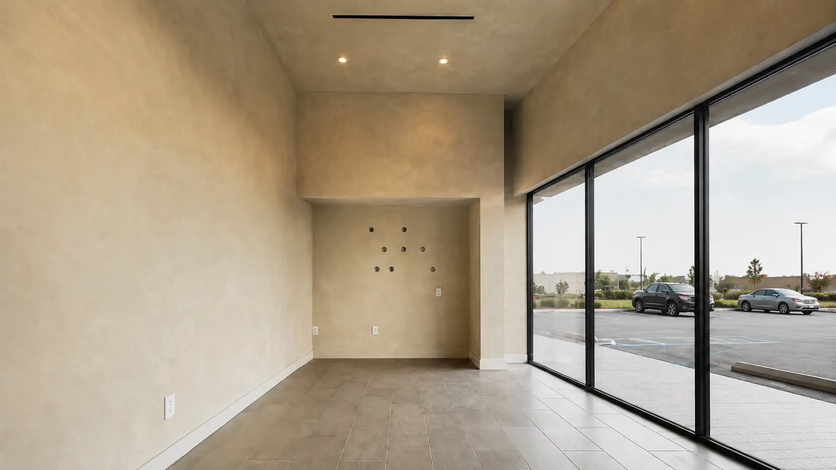 Lime wash walls in a tall, light-filled interior - soft, cloudy mineral finish