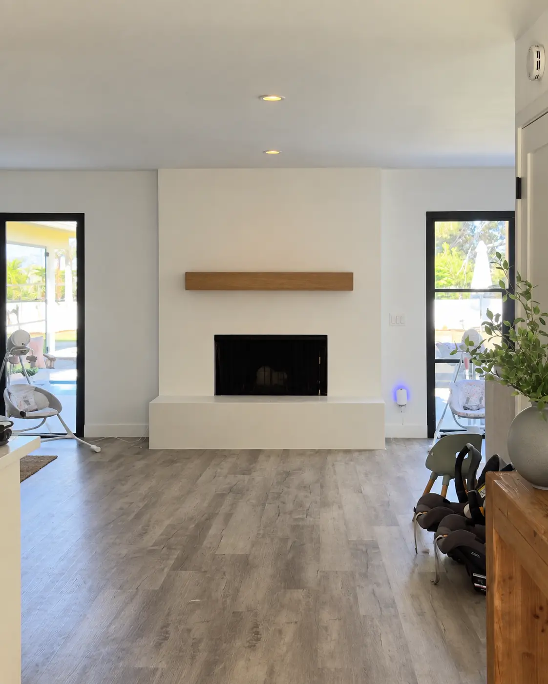 Completed Marmorino Tintoretto fireplace viewed within the Carlsbad living room.