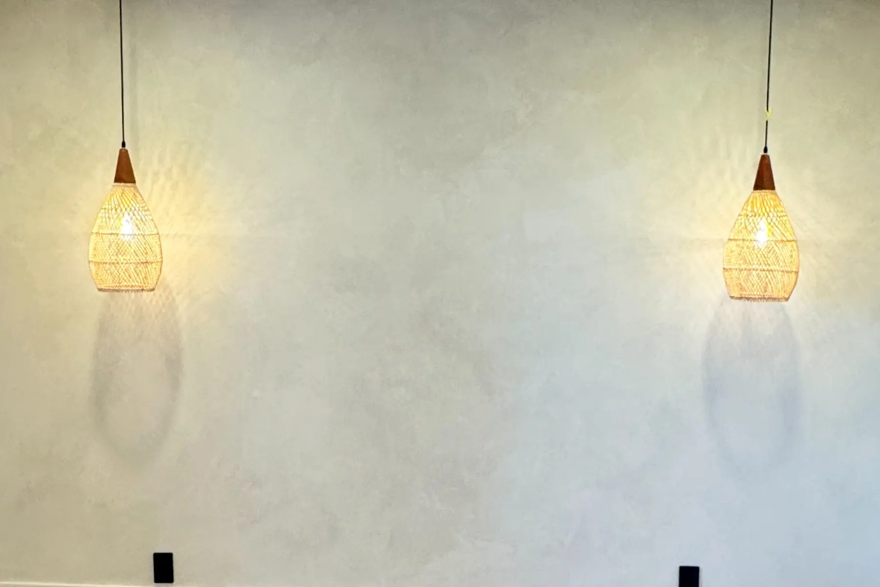 Soft matte lime wash wall with cloudy movement in daylight