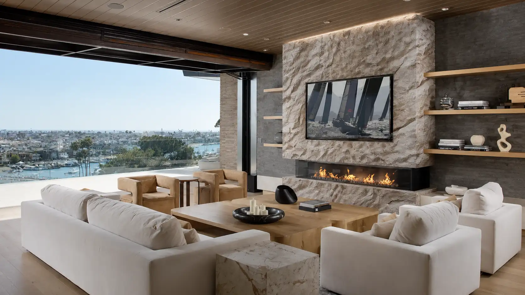 Stone-effect plaster feature wall - hand-sculpted, high-relief rock texture around a fireplace