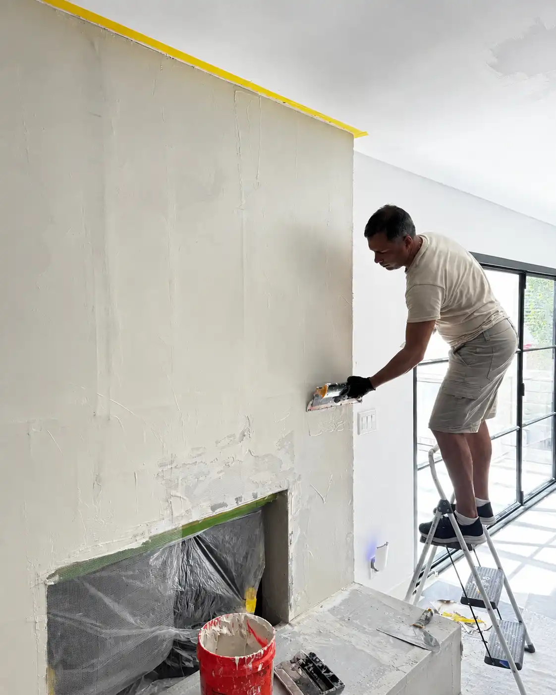 Fireplace form leveled to a smooth continuous plane across the chimney breast and hearth.