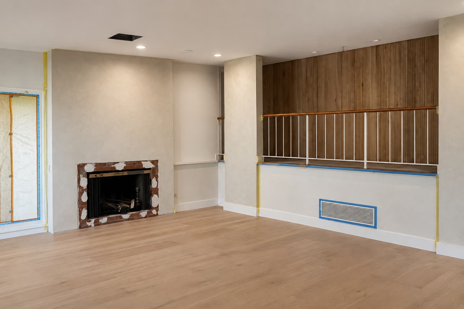 Completed living room with a lime wash fireplace wall and columns in a warm coffee tone, Tustin, Orange County.