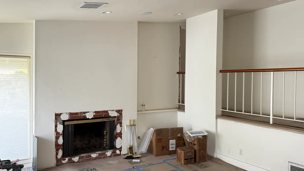 Living room fireplace wall and columns before lime wash, during renovation in a Tustin, Orange County home.